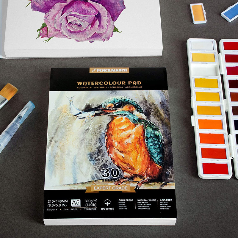 An A5 Pencilmarch artist watercolour paper pad with 300 gsm paper and 30 pages, next to a flower painting and paint set - Stationery Island