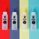 4 colours of bottles with dye inside that are from the TBC tie dye art party kit - Stationery Island