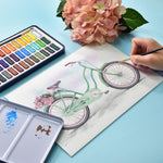 Colours from the 24 colours artist series watercolour paint set, used to create a painting of a bike - Stationery Island