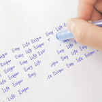 A person using an Ezigoo erasable pen to erase writing off a paper - Stationery Island