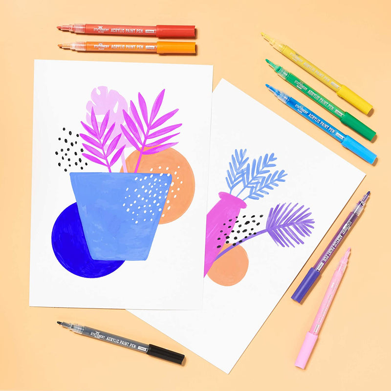 Flower drawing using acrylic paint pens with pens placed around the drawing - Stationery Island