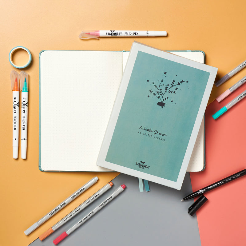 The Nicole Grace A5 dotted notebook, bullet journal surrounded by pens - Stationery Island