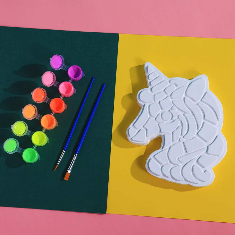 Paint, 2 paintbrushes and a stepping stone unicorn from the unicorn TBC painting your own stepping stone - Stationery Island 