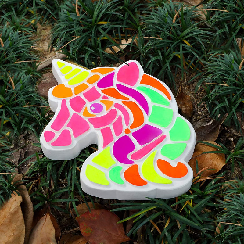 A stepping stone unicorn that has been painted, placed on the ground - Stationery Island