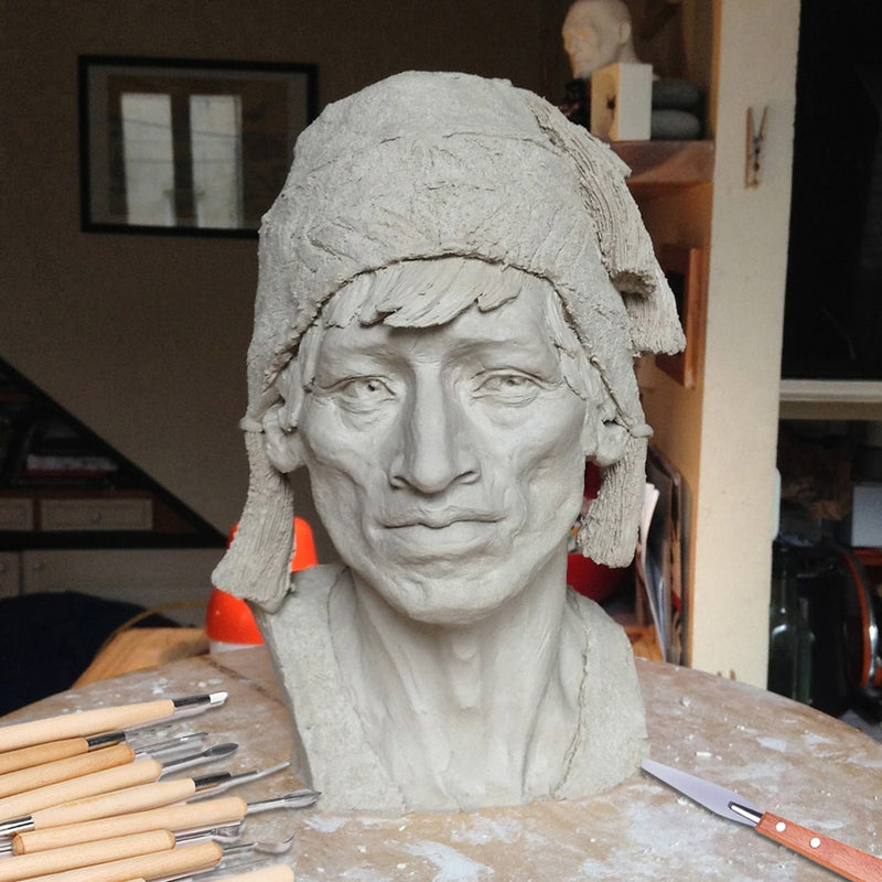A lady that has been sculpted using clay - Stationery Island