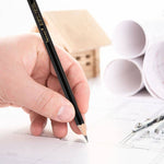 A person holding a drawing sketching pencil with their hand - Stationery Island
