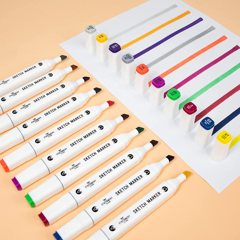The assorted colours sketch markers shown laying flat whilst opposite the lids and colour lines on a paper - Stationery Island